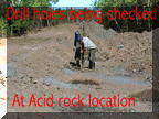 Acid-rock-Drill-holes-being-Ck.gif (15070 bytes)